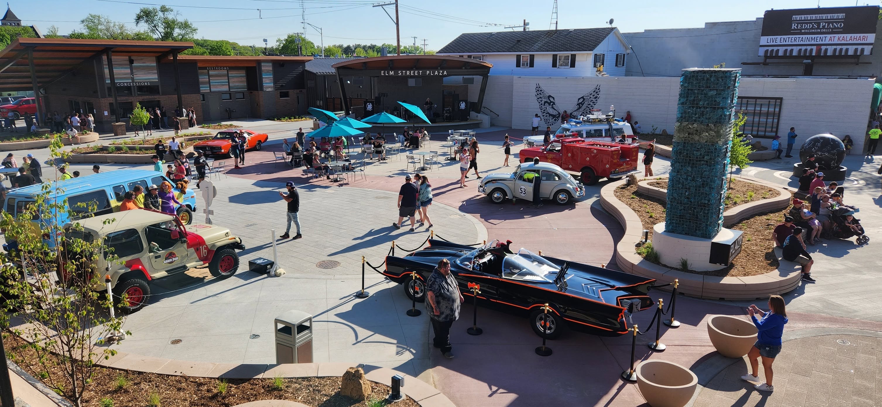 Aerial view of Elm Street Plaza filled with classic movie cars and crowds in Wisconsin Dells